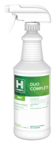 White spray bottle labeled Husky Duo Complete 801 with green and white design, used for cleaning, disinfection, and sanitizing. The bottle includes safety and active ingredient information.