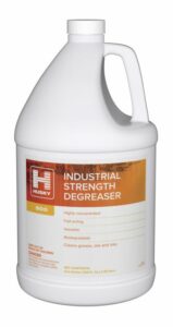A one-gallon jug of Husky Industrial Strength Degreaser with an orange and white label, featuring product details and safety information.