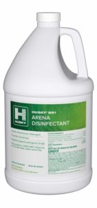 A white plastic gallon jug labeled 891 – Arena Disinfectant with green branding and safety information on the front. This arena disinfectant jug features a convenient handle and a secure screw cap for easy use.